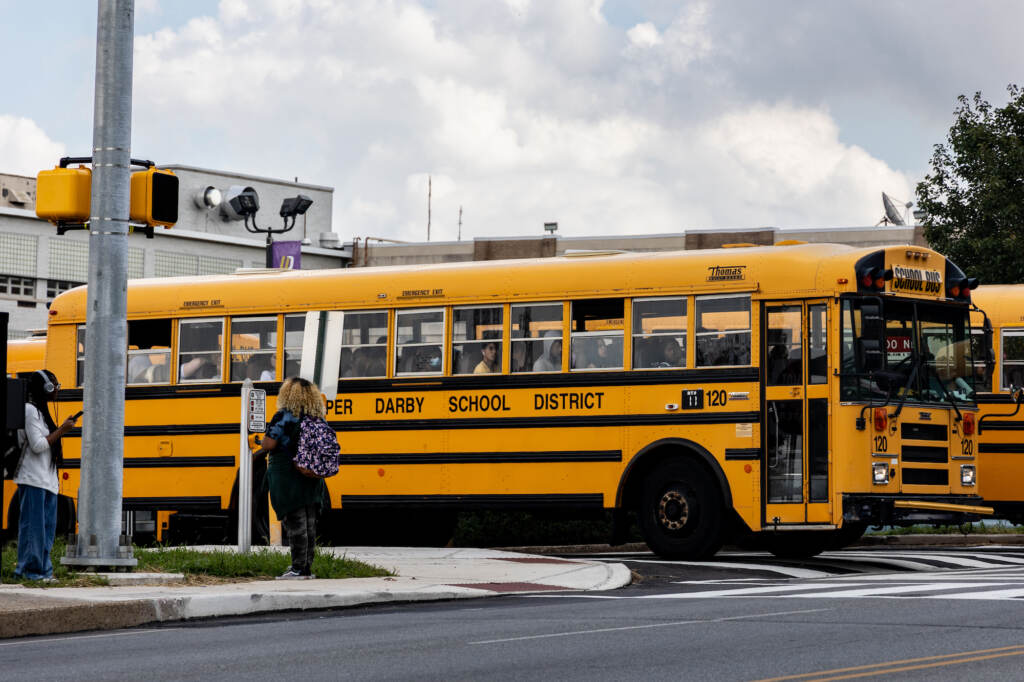 09 12 2022 k paynter upper darby high school file-6 A school bus pulls out of a parking lot.
