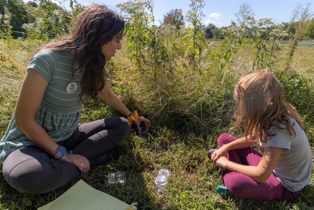09 26 2022 k paynter looking for insects FDR park meadowfest-2 Rebecca Deegan, and Carys Morken, 7, look for insects in FDR Park’s Meadowlands during the first day of Meadowfest on September 26, 2022. (Kimberly Paynter/WHYY)