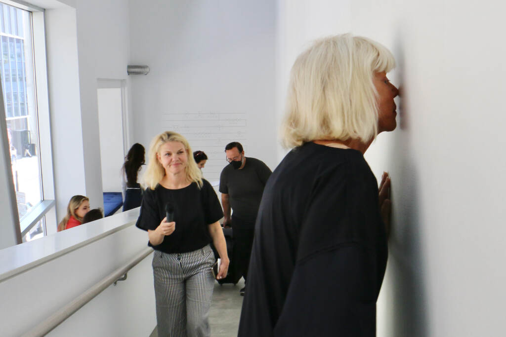 2020 09 16-e lee-philadelphia penn contemporary-sissel tolaas smell exhibition sweat Sissel Tolaas stops to smell a wall imbedded with the recorded and replicated sweat of anxious men at her exhibit ''RE______'' at the Institute of Contemporary Art at Penn. (Emma Lee/WHYY)