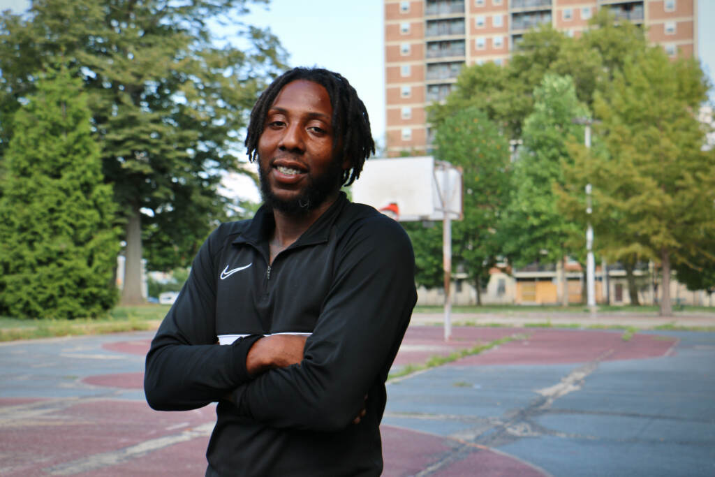 2022 08 29-e lee-reggie johnson-philadelphia fotteral square park-rebuild Reggie Johnson stands on the basketball court at Fotteral Square Park. He is optimistic that the Rebuild of the park and the renovation of the Fairhill Apartments for senior housing will make the neighborhood safer. (Emma Lee/WHYY)