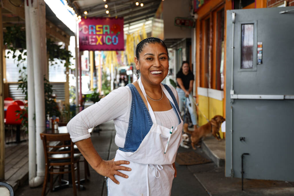 2022 09 08 K PAYNTER OUR MARKET PROJECT-2 Cristina Martínez at her restaurant Casa Mexico. The lightbox outside honors her late son, Isaias Berriozabal-Martínez, with a poem he wrote. (Kimberly Paynter/WHYY)