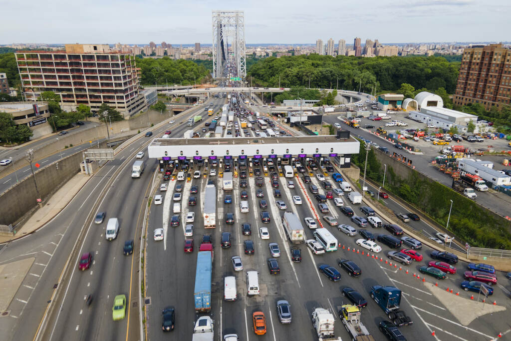 GW Bridge Cashless Tolling Traffic passes through the toll plaza at the George Washington Bridge in Fort Lee, New Jersey, on Friday, June 10, 2022. The busy bridge connecting New Jersey and New York City is moving to cashless tolls. Beginning in July, drivers paying cash tolls will have their license plates scanned and will be billed by mail. As part of the transformation, the tollbooths and islands will be demolished. (AP Photo/Ted Shaffrey)