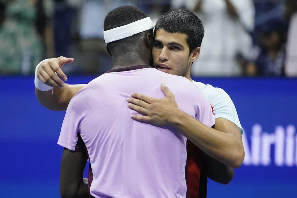 US Open Tennis Carlos Alcaraz, of Spain (right) hugs Frances Tiafoe, of the United States, after winning their semifinal match of the U.S. Open tennis championships, Friday, Sept. 9, 2022, in New York. (AP Photo/John Minchillo)