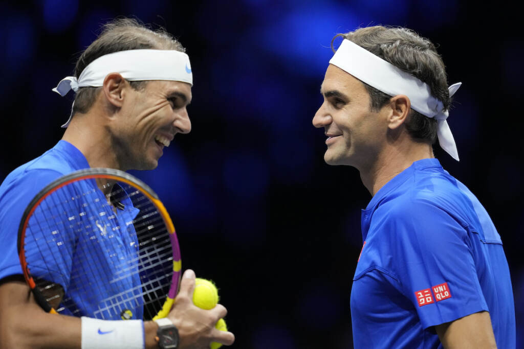 APTOPIX Britain Tennis Laver Cup Team Europe's Roger Federer, right, and Rafael Nadal react during their Laver Cup doubles match against Team World's Jack Sock and Frances Tiafoe at the O2 arena in London, Friday, Sept. 23, 2022. (AP Photo/Kin Cheung)