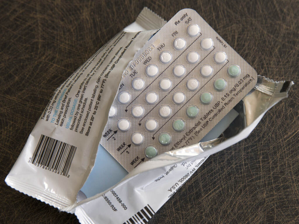 Birth Control Breast Cancer A birth control packet sits unused in open plastic wrapping.