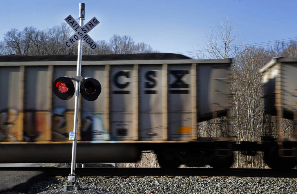 Earns CSX In this March 22, 2014, file photo, a CSX freight train rolls past a grade crossing in Mount Airy, Md. CSX Corp. on Wednesday, Oct. 12, 2016, reported better-than-expected net income in the third quarter even as coal volumes continued double-digit declines. (AP Photo/Patrick Semansky, File)