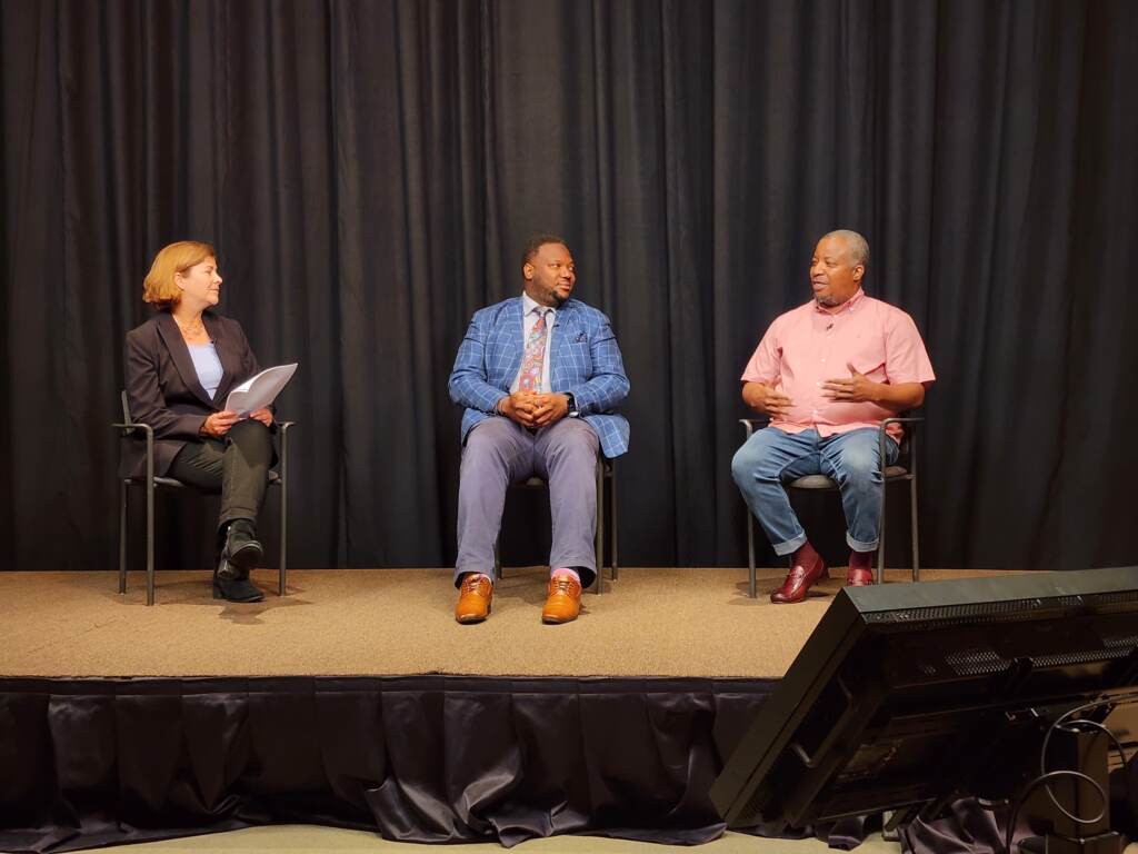 discussion-pulse-mighty-writers-2 Three people are seated on a stage.