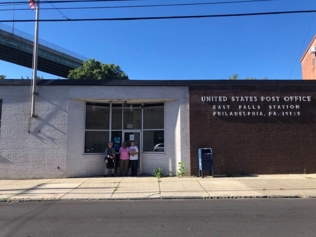 east-falls-post-office-1 Three people stand in front of a building which reads