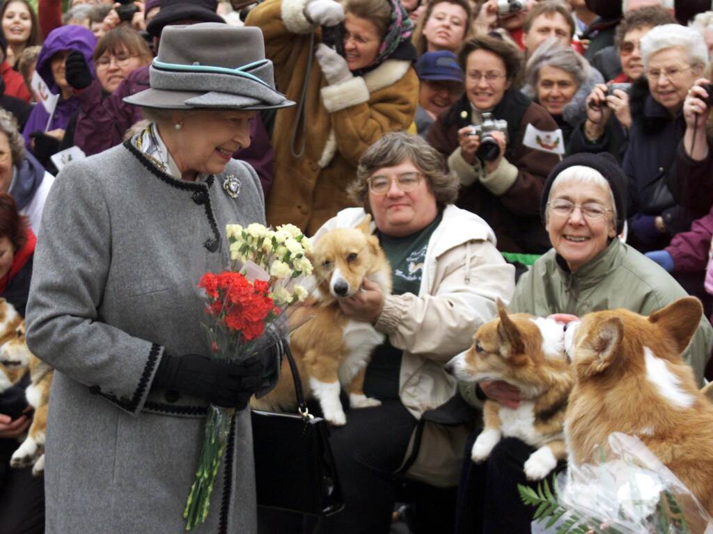Queen Elizabeth II talks with members of the Manitoba Corgi Association during a visit to Winnipeg, Canada, in October 2002. Queen Elizabeth II talks with members of the Manitoba Corgi Association during a visit to Winnipeg, Canada, in October 2002. (Adrian Wyld/AFP via Getty Images)