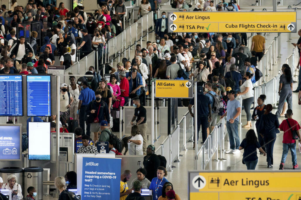 Business Travel FILE - People wait in a TSA line at the John F. Kennedy International Airport in New York, Tuesday, June 28, 2022. With summer vacations winding down, airlines are counting on the return of more business travelers to keep their pandemic recovery going into fall 2022. Air travel in the United States, bolstered by huge numbers of tourists, has nearly recovered to pre-pandemic levels. Business travel, however, remains about 25% to 30% below 2019 levels, according to airlines and outfits that track sales. (AP Photo/Julia Nikhinson, File)