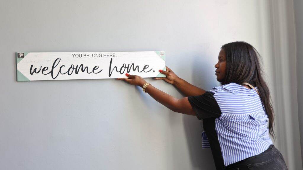 lgbtqshelter-arkofsafety-06-1024×576 Tatyana Woodard tests space to hang art at Ark of Safety, a new North Philly shelter for LGBTQ people. (Kimberly Paynter/WHYY)