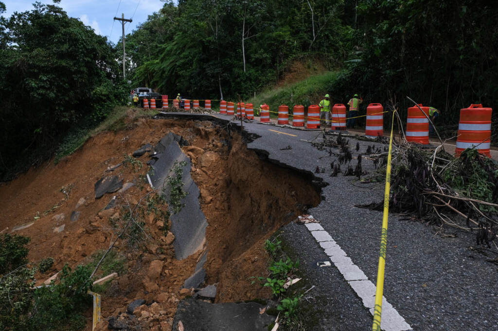 Getting into the community of Cacao is a challenge. The 157 route is being cleared after major landslides caused by Hurricane Fiona blocked access. Mud and pieces of a road are falling apart on a highway.