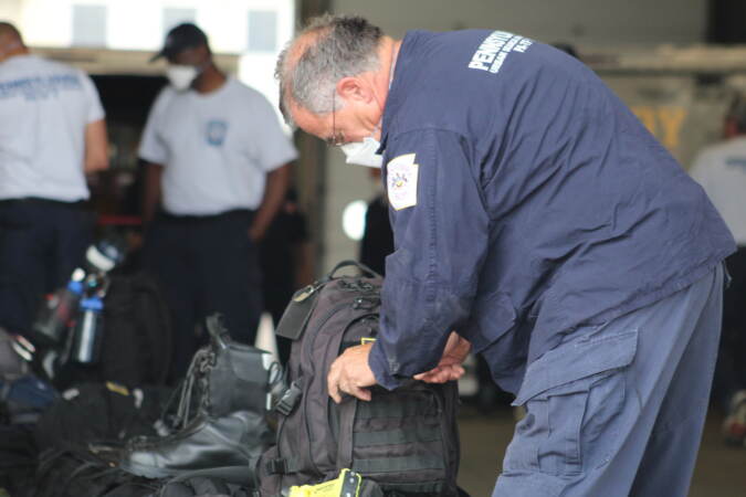 Pennsylvania Task Force 1 gets their equipment ready ahead of deploying to South Carolina to aid potential victims of Hurricane Ian on Sep. 28, 2022. (Cory Sharber / WHYY)