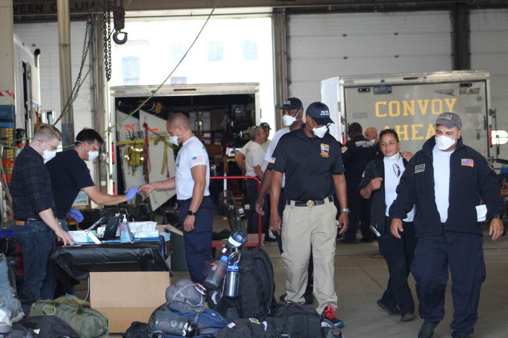 pa-task-force-1-c-sharber-2022-09-28-6 Pennsylvania Task Force 1 gets their equipment ready ahead of deploying to South Carolina to aid potential victims of Hurricane Ian on Sep. 28, 2022. (Cory Sharber / WHYY)