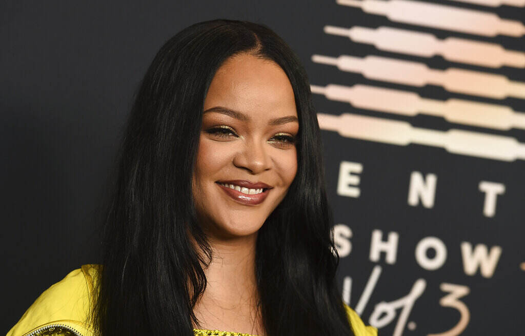 Up-close photo of Rihanna smiling.