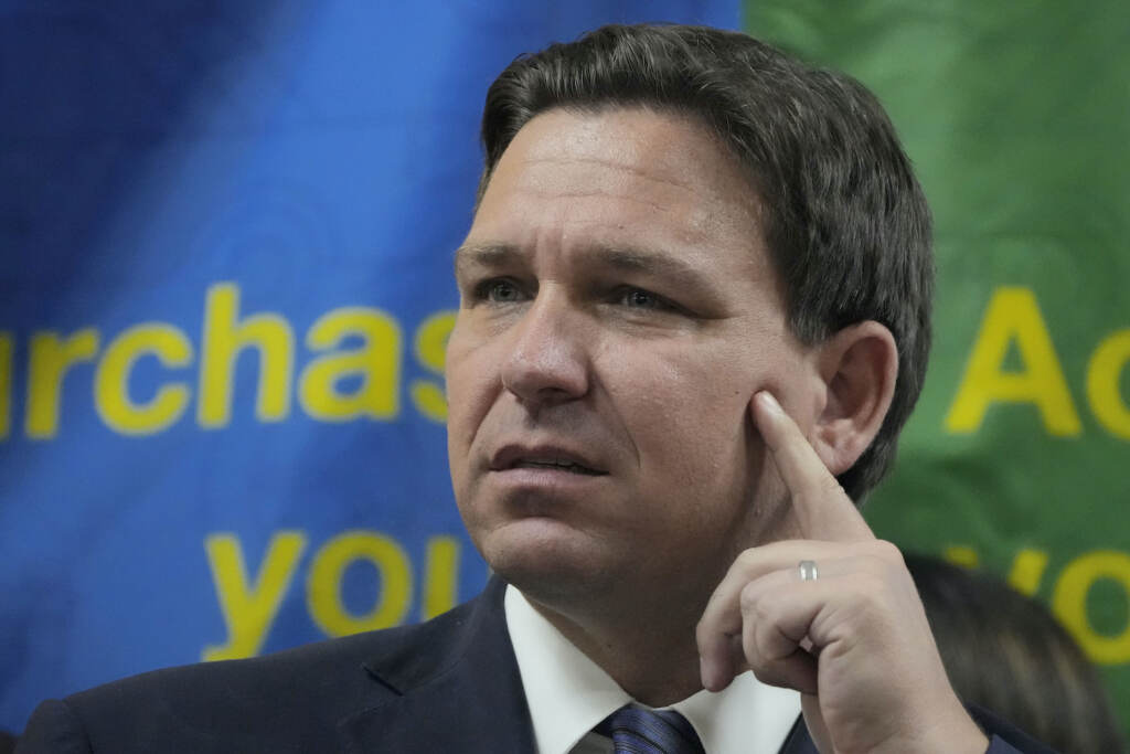 Election 2022 Transporting Migrants FILE - Florida Gov. Ron DeSantis listens to a question during a press conference Sept. 7, 2022, in Miami, Fla. The Republican governors of Florida and Texas have delivered migrants on planes and buses to Washington, D.C., New York City and even Martha's Vineyard, but they may just be getting started. (AP Photo/Rebecca Blackwell, File)