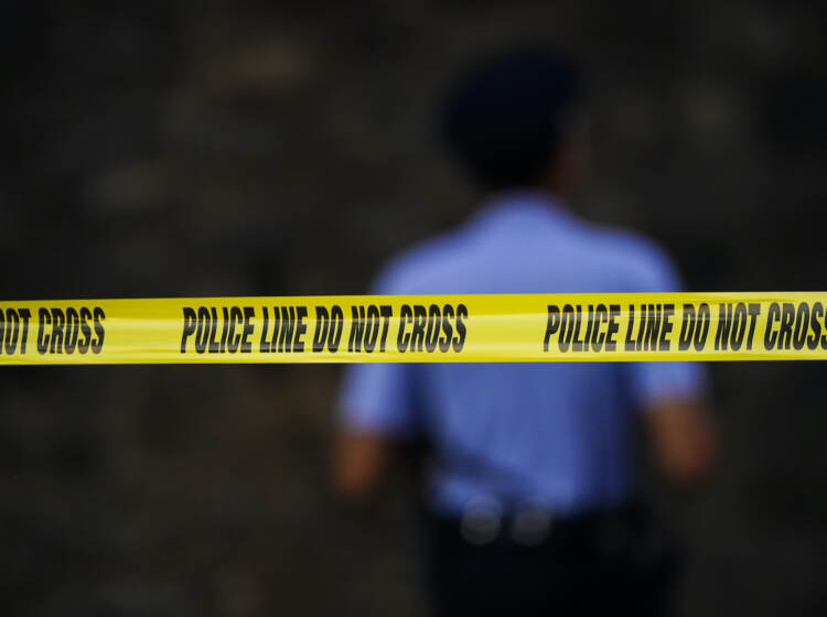 Tape cordons off the area around the scene where multiple people were shot near a high school in Philadelphia