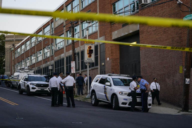 Investigators work the scene where multiple people were shot near a high school in Philadelphia