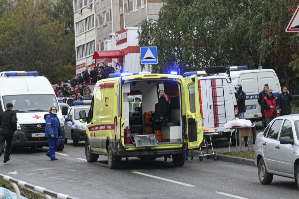 Russia School Shooting Police and paramedics work at the scene of a shooting at school No. 88 in Izhevsk