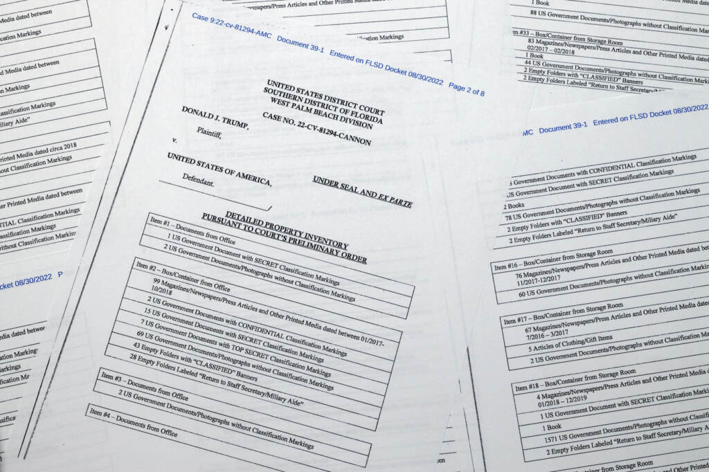 Trump FBI Pages from a FBI property list of items seized from former President Donald Trump's Mar-a-Lago estate and made public by the Department of Justice, are photographed Friday, Sept. 2, 2022. FBI agents who searched the home found empty folders marked with classified banners. The inventory reveals in general terms the contents of the 33 boxes taken during the Aug. 8 search. (AP Photo/Jon Elswick)