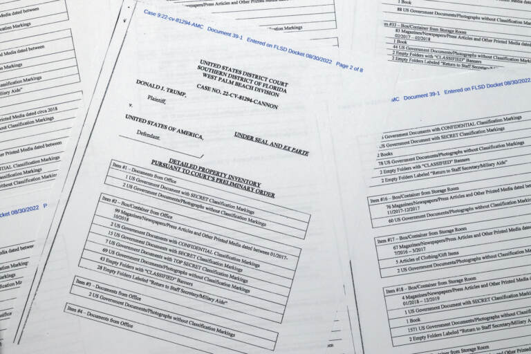 Pages from a FBI property list of items seized from former President Donald Trump's Mar-a-Lago estate and made public by the Department of Justice, are photographed Friday, Sept. 2, 2022. FBI agents who searched the home found empty folders marked with classified banners. The inventory reveals in general terms the contents of the 33 boxes taken during the Aug. 8 search. (AP Photo/Jon Elswick)