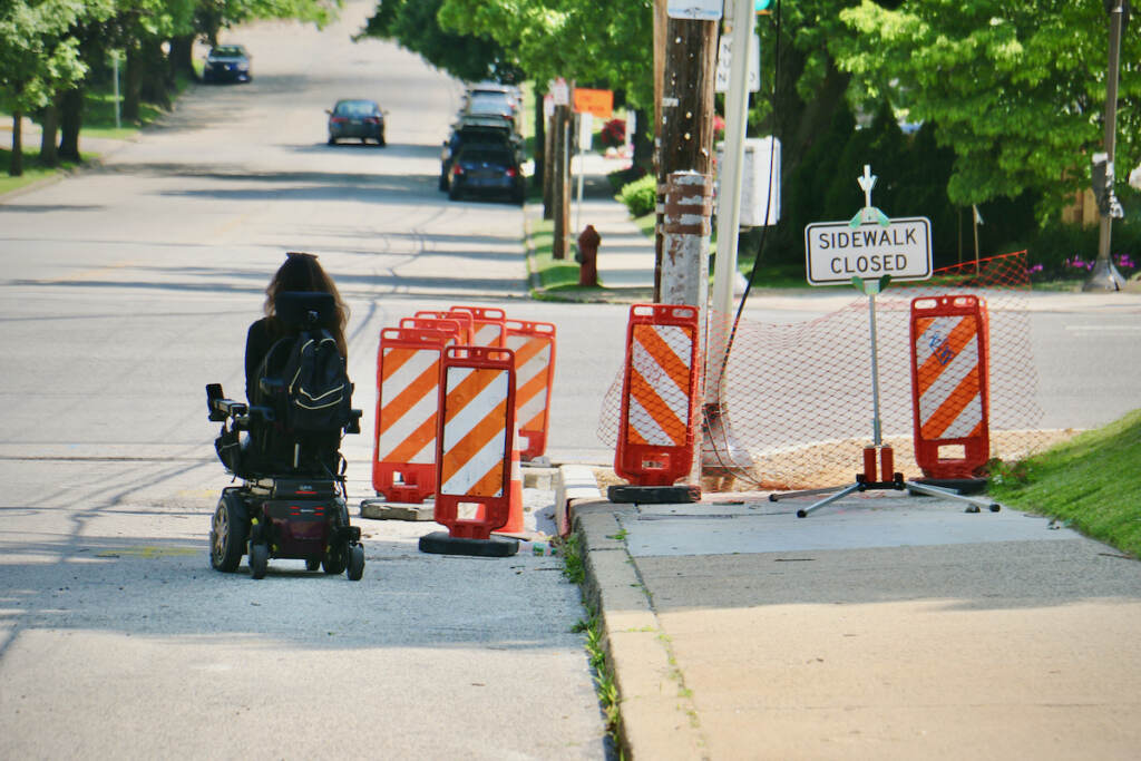 2022 06 02-e lee-anomie fatale-philadelphia roxborough-sidewalk inaccessibility around the barriers Anomie Fatale maneuvers around the closed sidewalk at the intersection of Port Royal and Henry avenues. The construction blocked her only safe route to the CVS near her home. (Emma Lee/WHYY)