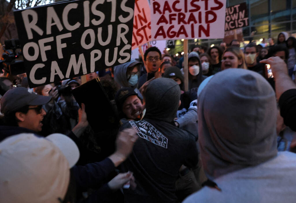 A man wearing a Proud Boys shirt fights with protesters ahead of an event featuring far-right group Proud Boys’ founder Gavin McInnes at Pennsylvania State University in State College, Pa., on Monday. The event was canceled by Penn State officials, who cited “the threat of escalating violence.” A man wearing a Proud Boys shirt fights with protesters ahead of an event featuring far-right group Proud Boys' founder Gavin McInnes at Pennsylvania State University in State College, Pa., on Monday. The event was canceled by Penn State officials, who cited ''the threat of escalating violence.'' (Leah Millis/Reuters)