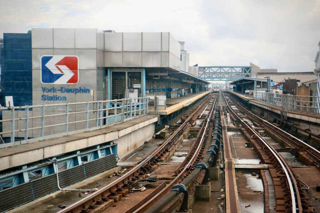 A view of a train on the elevated train tracks next to the York-Dauphin station.
