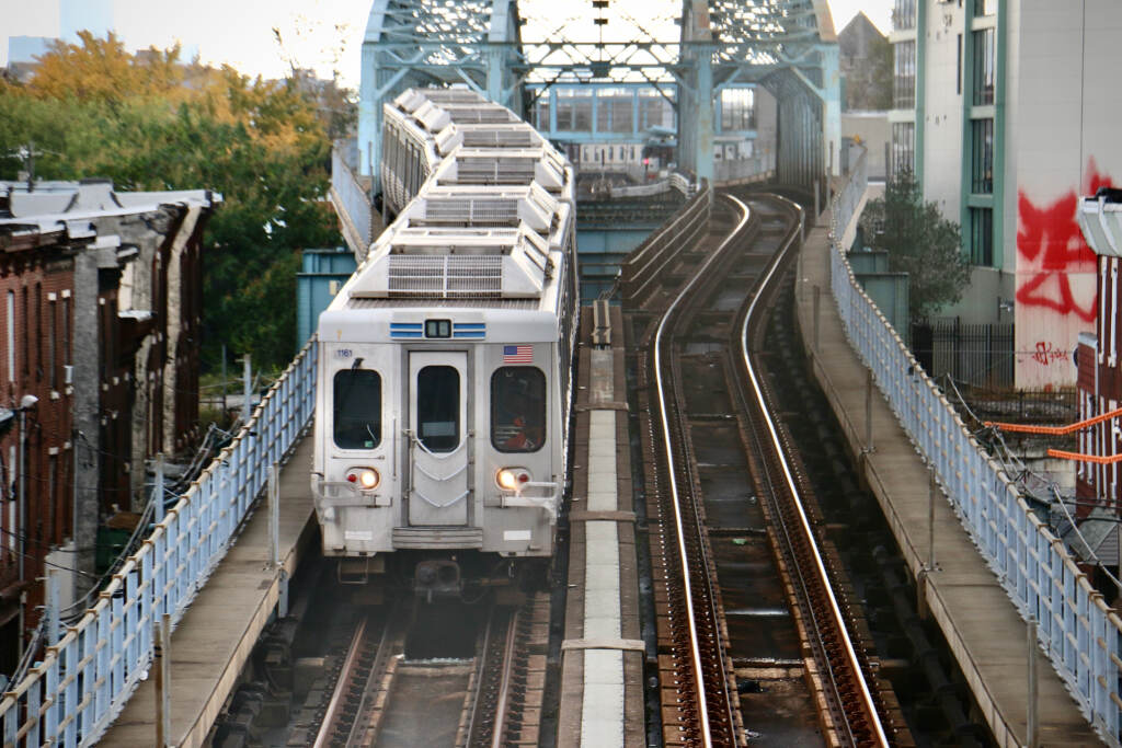 The Market Frankford train approaches Somerset Station. (Emma Lee/WHYY) A train on tracks as seen from above.