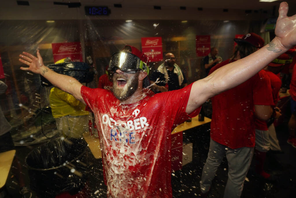Phillies Astros Baseball Philadelphia Phillies' Bryce Harper celebrates after the Phillies won against the Houston Astros to clinch a wild-card playoff spot, Monday, Oct. 3, 2022, in Houston. (AP Photo/David J. Phillip)