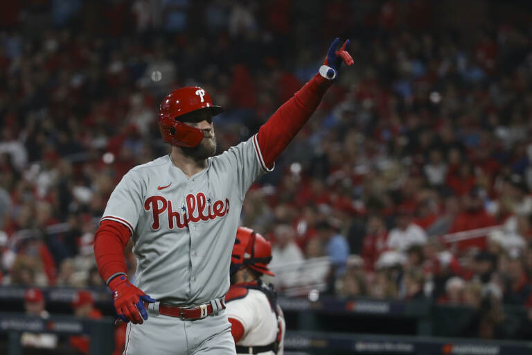 Philadelphia Phillies' Bryce Harper reacts after hitting a solo home run during the second inning in Game 2 of a National League wild-card baseball playoff series against the St. Louis Cardinals, Saturday, Oct. 8, 2022, in St. Louis. (AP Photo/Scott Kane)