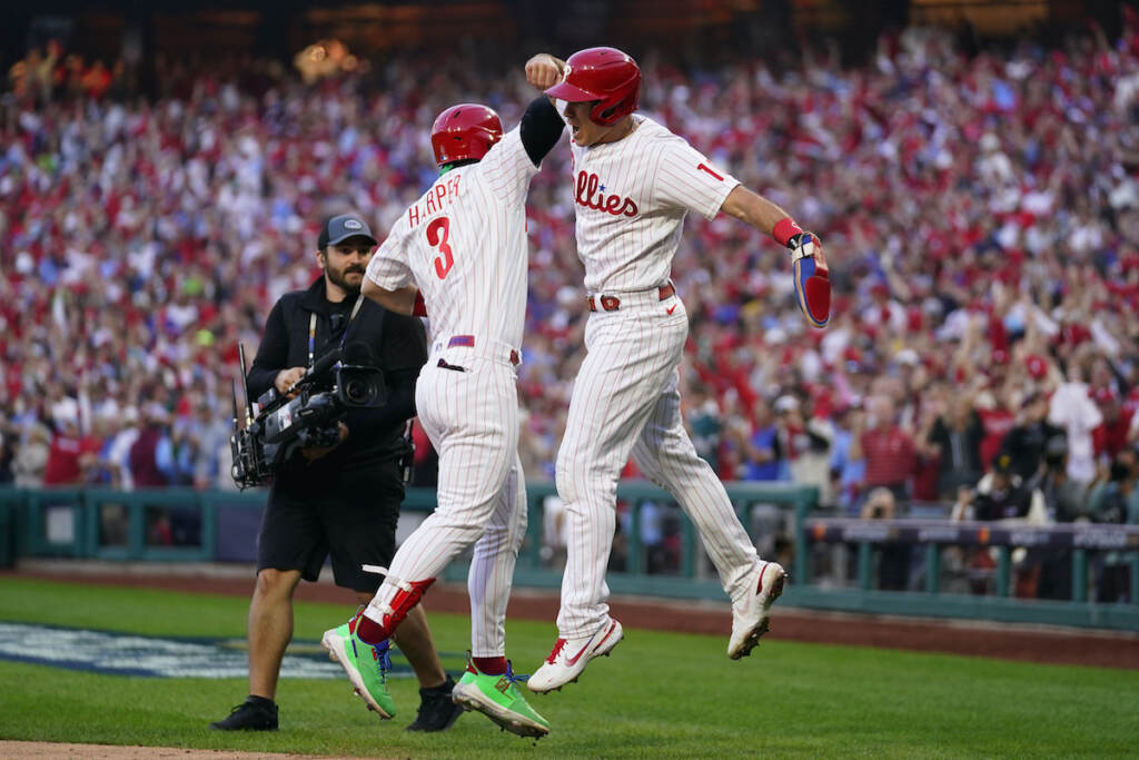 Braves Phillies Baseball Philadelphia Phillies' Rhys Hoskins (17) celebrates with Bryce Harper (3) after hitting a three-run home run during the third inning in Game 3 of baseball's National League Division Series against the Atlanta Braves, Friday, Oct. 14, 2022, in Philadelphia. (AP Photo/Matt Slocum)