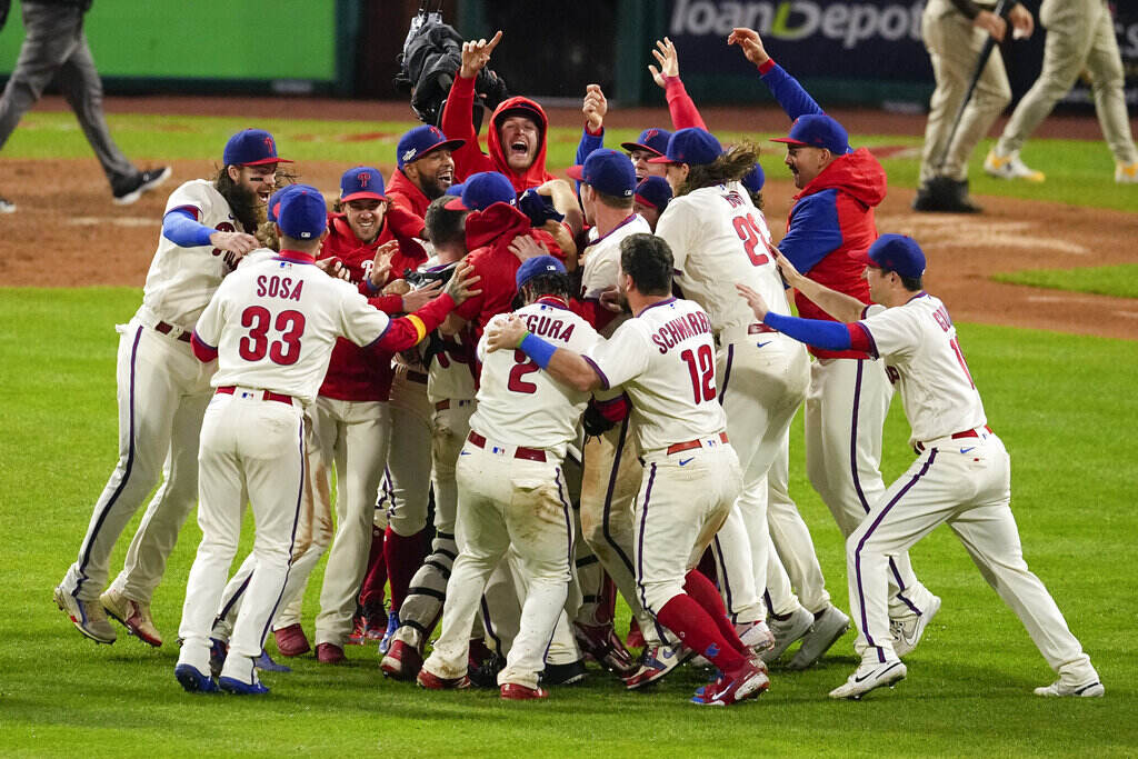 NLCS Padres Phillies Baseball Philadelphia Phillies celebrate after winning the baseball NL Championship Series in Game 5 against the San Diego Padres on Sunday, Oct. 23, 2022, in Philadelphia. (AP Photo/Matt Rourke)