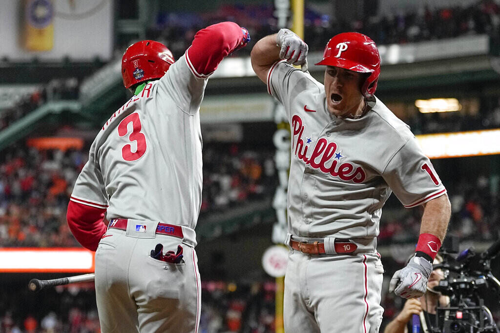 World Series Phillies Astros Baseball Two Phillies players do an elbow bump.