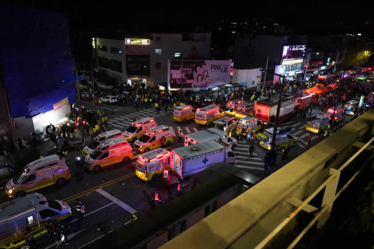 Ambulances and emergency responders are visible from above.