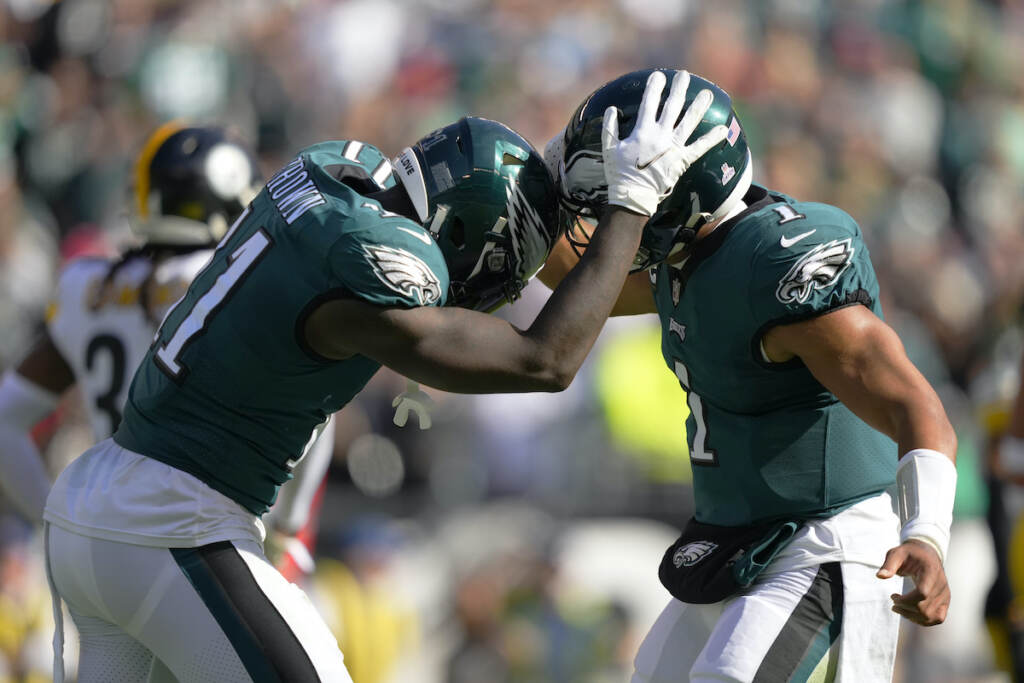 Philadelphia Eagles wide receiver A.J. Brown (11) celebrates his third touchdown reception with quarterback Jalen Hurts during the first half of an NFL football game between the Pittsburgh Steelers and Philadelphia Eagles, Sunday, Oct. 30, 2022, in Philadelphia. (AP Photo/Matt Slocum)