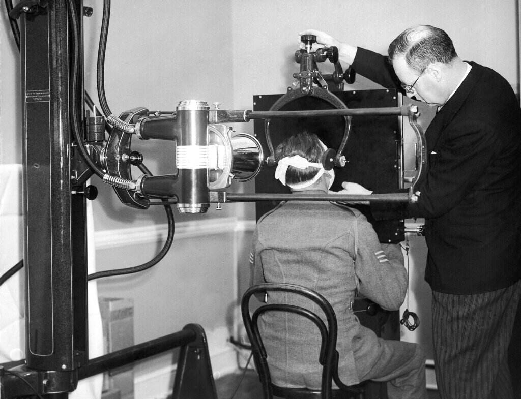 Cochrane Shanks The Allied Relief Fund of America, which has supplied the Allies with many valuable gifts of hospital equipment, is presenting Britain with a number of valuable x-ray installations. Sir Harold Gillies, the famous surgeon, and Dr. Cochrane Shanks, chief radiologist to the Ministry of Health accepted this gift formally at Brookwood House, Basingstoke, and thanked Bertram Cruger, representative of the fund, warmly. Dr. Cochrane Shanks using the £10,000 x-ray apparatus on a patient in England July 19, 1940. (AP Photo)