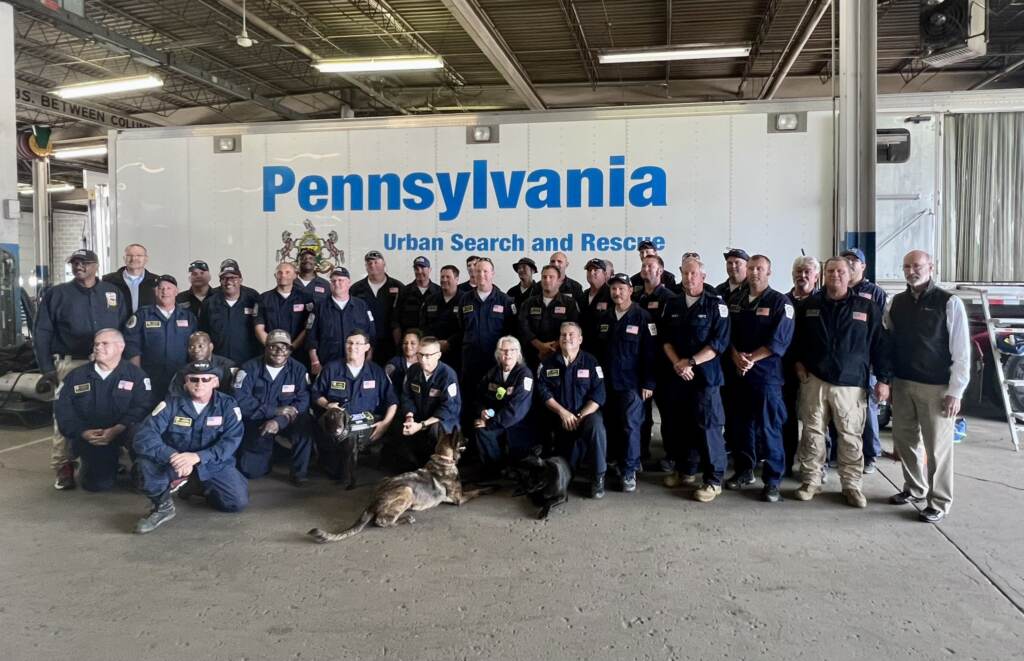 Fe4_tRtWQAEtWem Pennsylvania Task Force 1 pose with Pa. Gov. Tom Wolf (far right) after returning to Philadelphia. (@PhillyFireDept/Twitter)