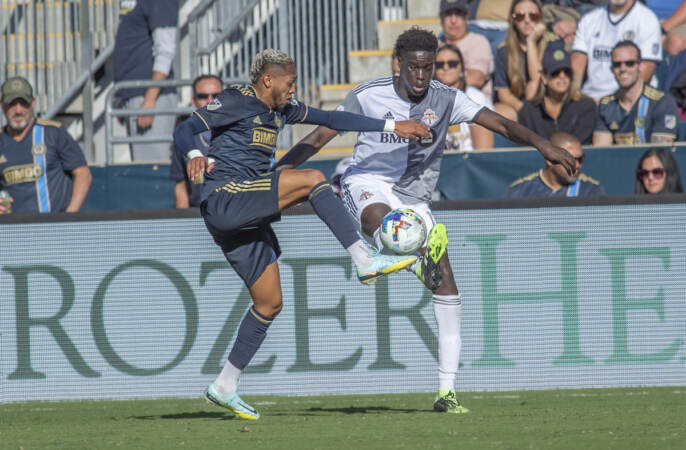 The Union's José Martínez and Toronto's Noble Okello attempt to gain control of the ball in the second half of the match. (Jonathan Wilson/WHYY)