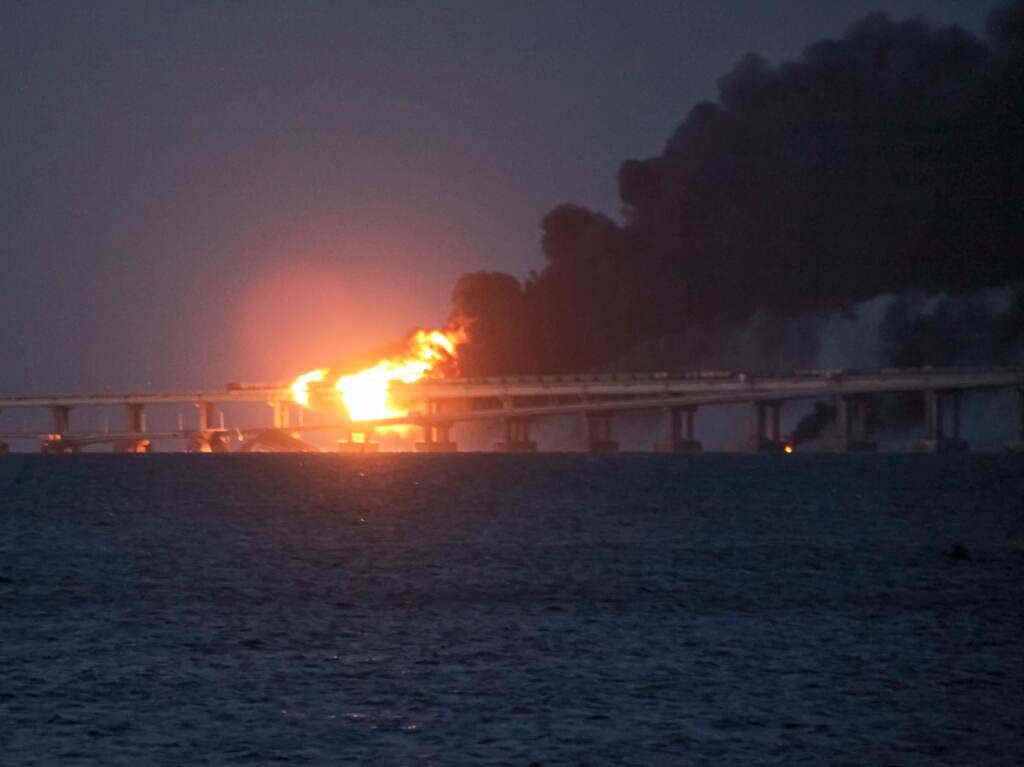 ap22281532031585-96ef7eb660dda90209f243166326058dfeae7216-s1600-c85 Flame and smoke rise from the bridge connecting the Russian mainland and the Crimean peninsula early Saturday. (AP)