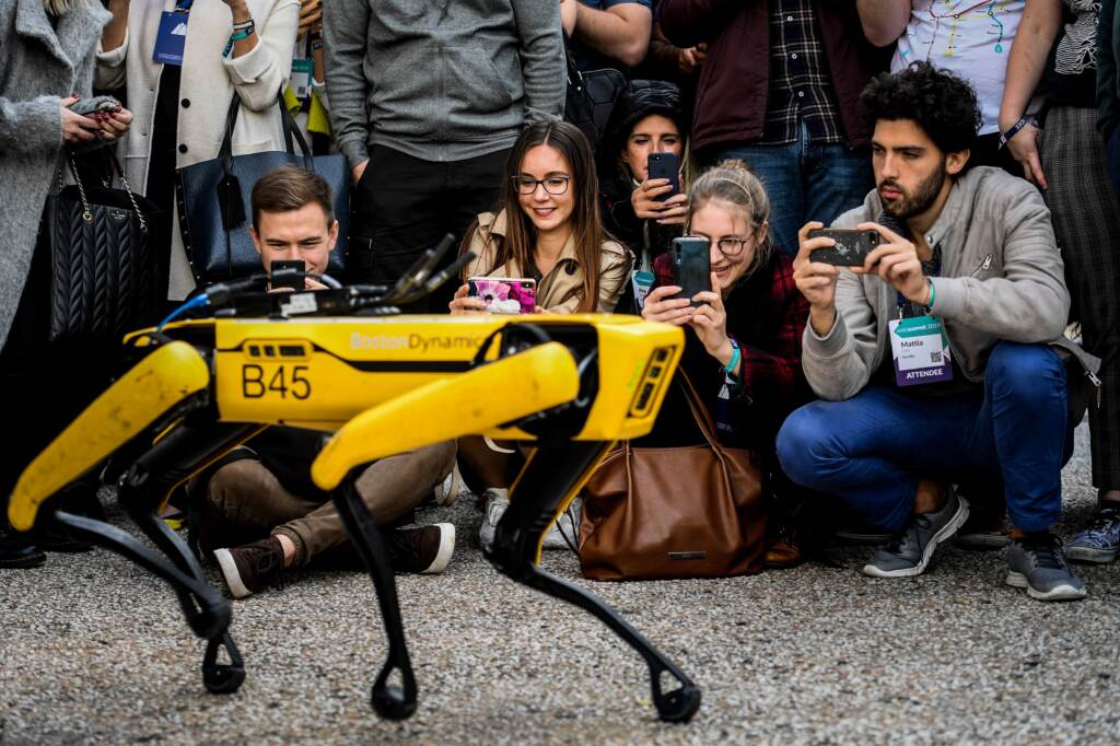 People take pictures and videos of the Boston Dynamics robot Spot during an event in Lisbon in 2019. People take pictures and videos of the Boston Dynamics robot Spot during an event in Lisbon in 2019. (Patricia De Melo Moreira/AFP via Getty Images)