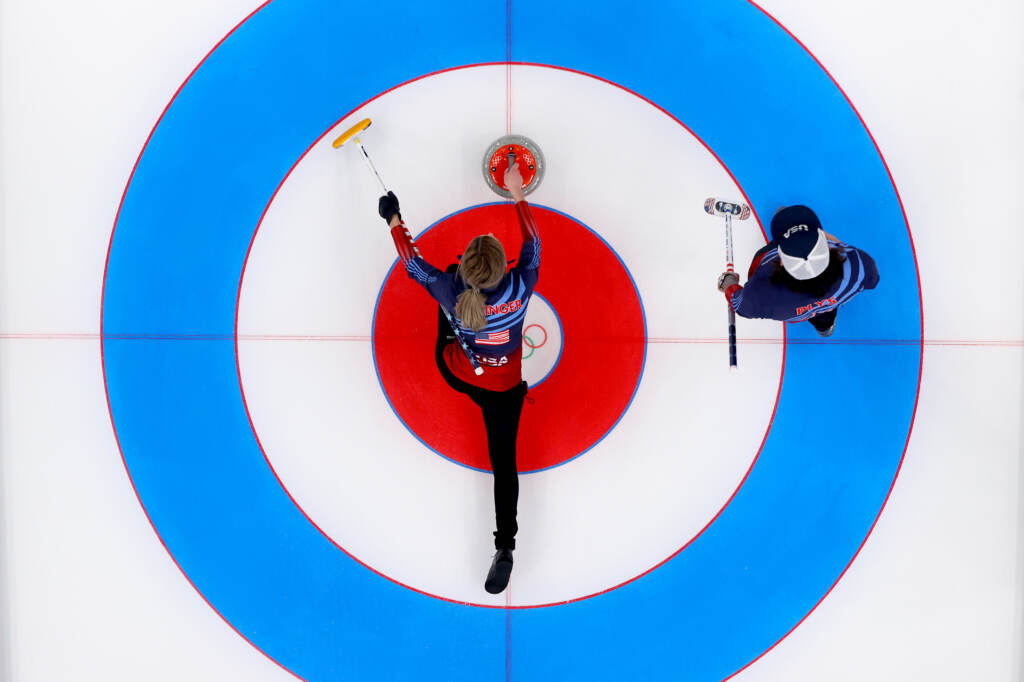 Victoria Persinger (left) and Christopher Plys of Team USA compete against Team Norway during the Curling Mixed Doubles Round Robin ahead of the Beijing 2022 Winter Olympics at the National Aquatics Center in Beijing on on Feb. 3. Victoria Persinger (left) and Christopher Plys of Team USA compete against Team Norway during the Curling Mixed Doubles Round Robin ahead of the Beijing 2022 Winter Olympics at the National Aquatics Center in Beijing on on Feb. 3. (Lintao Zhang/Getty Images)