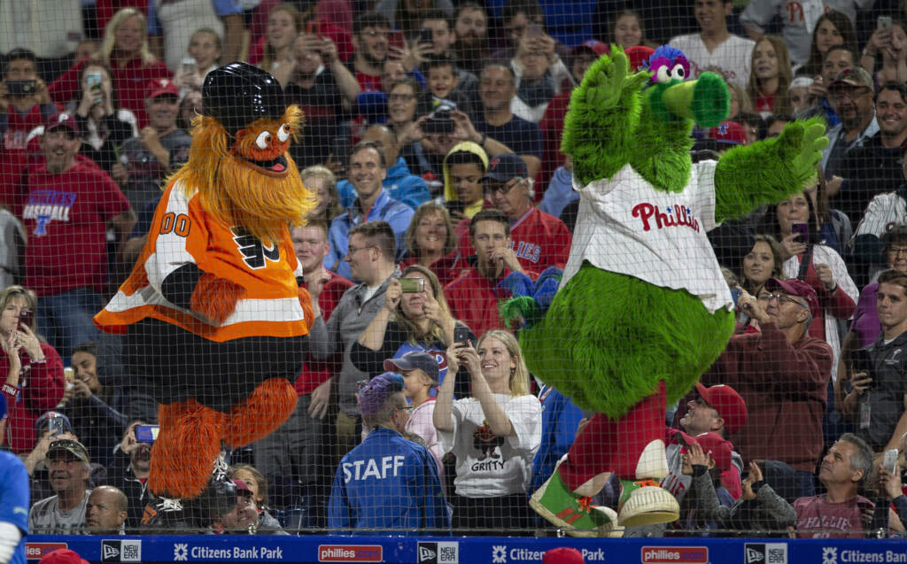 Braves Phillies Baseball Gritty, the Philadelphia Flyers' mascot, left, and the Philly Phanatic dance during a baseball game