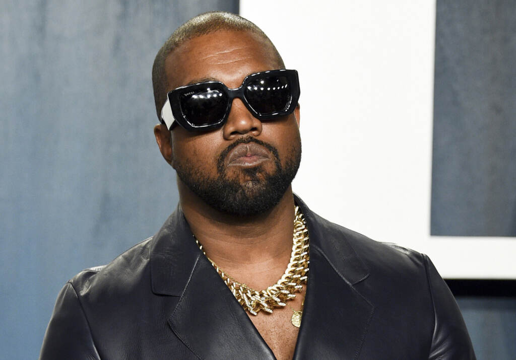Kanye West An up-close photo of Ye wearing sunglasses.