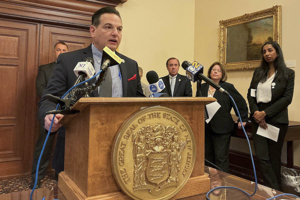 New Jersey Democratic Senate President Nicholas Scutari introduces new legislation governing the state's handgun carry law on Thursday, Oct. 13, 2022, in Trenton, N.J. Surrounded by other lawmakers and gun legislation advocates, Scutari said he thinks the proposal, which specifies that guns can't be carried in schools and other places, fits with the Supreme Court's June ruling that expanded carry rights by striking down a New York law. (AP Photo/Michael Catalini)
