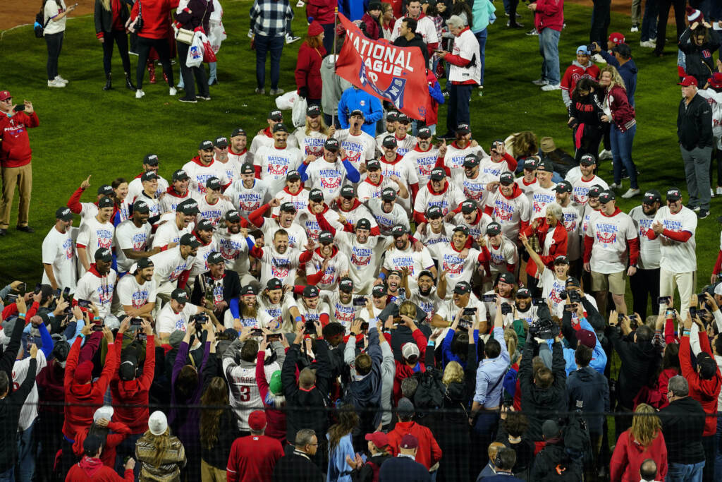 NLCS Padres Phillies Baseball Philadelphia Phillies celebrate after winning the National League Championship Series