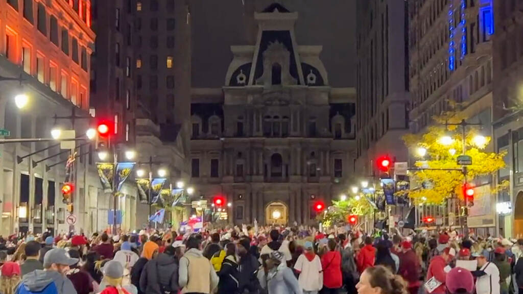 phillies-pennant-celebration-01 Crowds converge on Broad Street, with City Hall visible in the background.