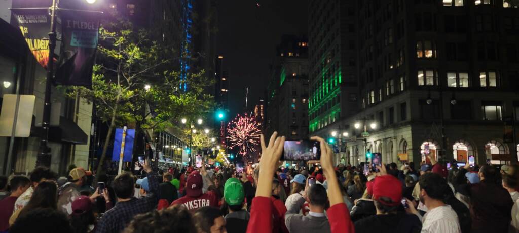 Fans celebrate on Broad Street on Oct. 23, 2022 after the Philadelphia Phillies clinch the pennant.