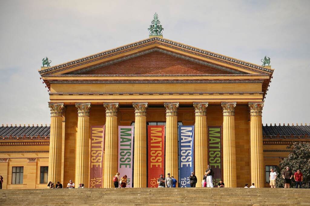 A view from below of a large building with columns.