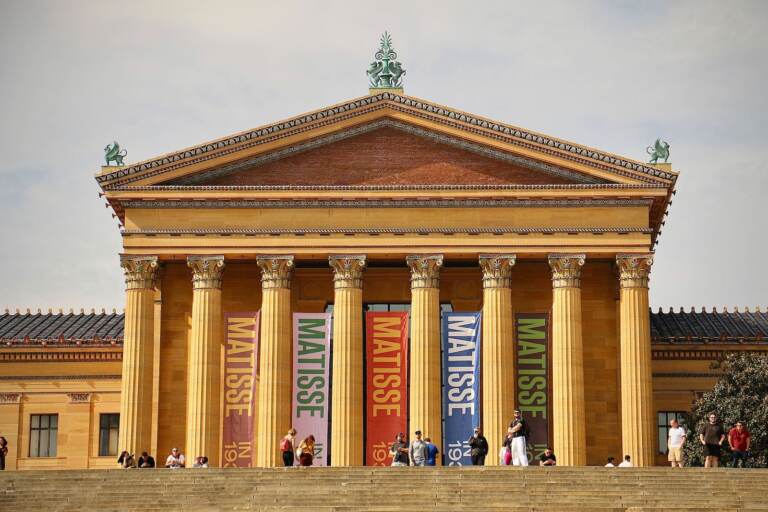 A view from below of a large building with columns.